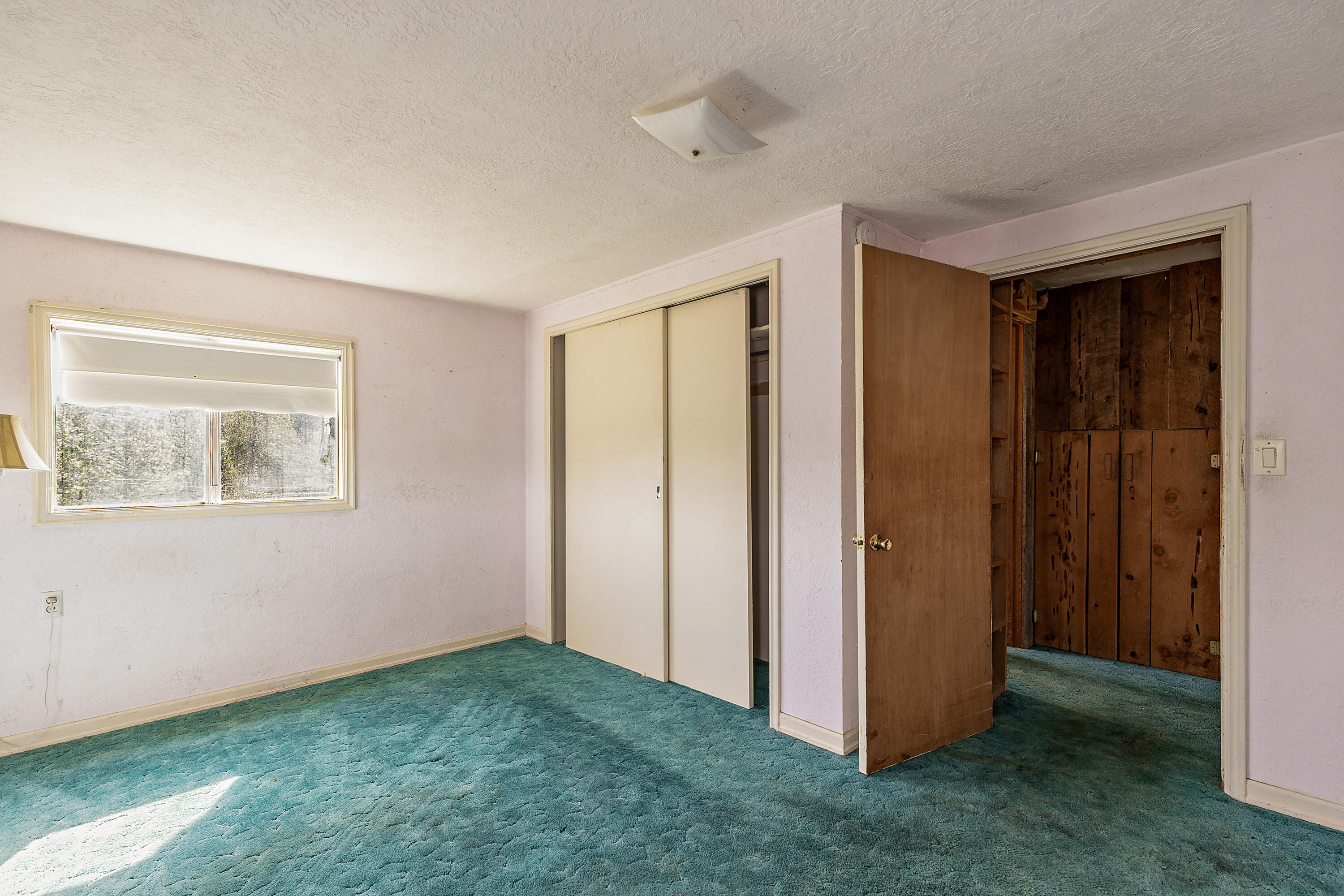 2150 North Obenchain Road Eagle Point, OR 97524 - Photo 64 of 69 a view of an empty room with closet and a window