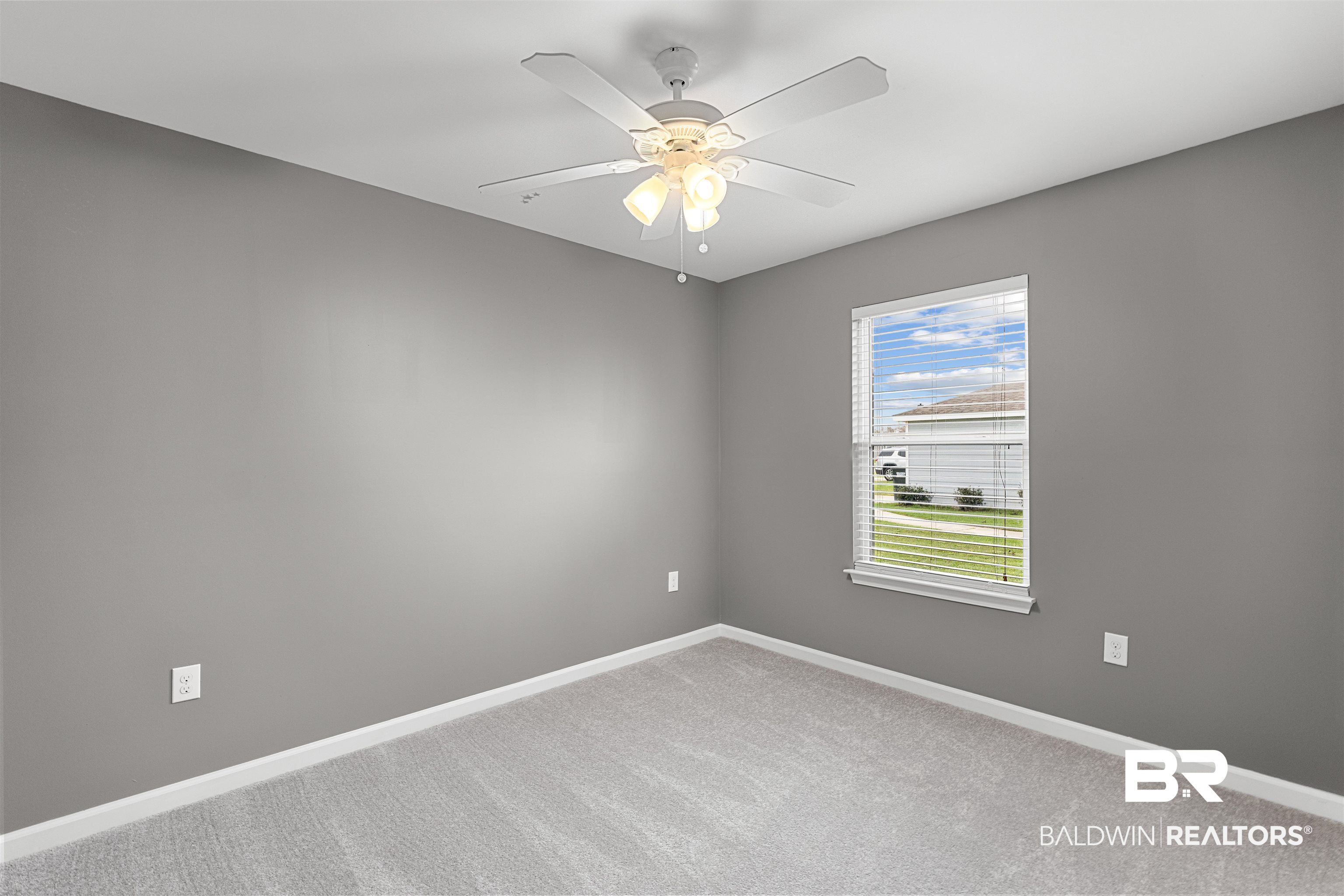 15131 Marem Drive Foley, AL 36535 - Photo 9 of 13 Spare room with a ceiling fan and light carpet