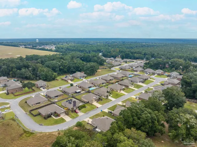 a view of a livingroom with furniture window and wooden floor