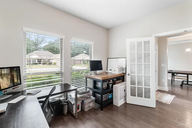 a spacious bathroom with a bathtub sink and mirror