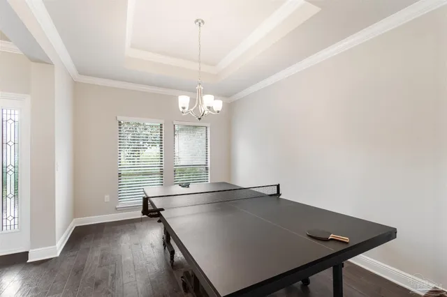 a spacious bathroom with a granite countertop sink a mirror and a bathtub