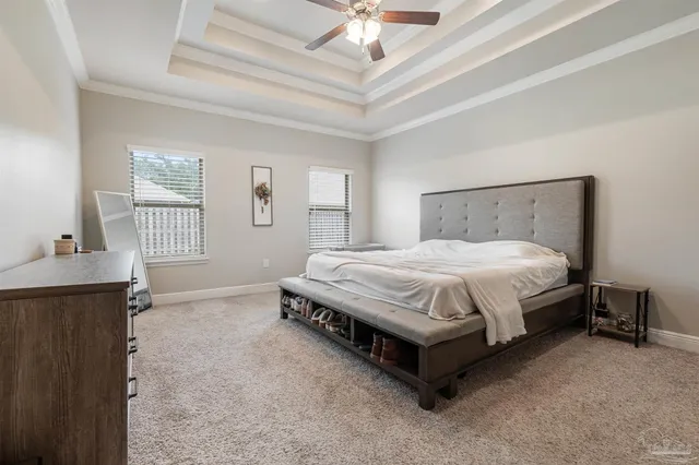 a living room with furniture and a flat screen tv with wooden floor