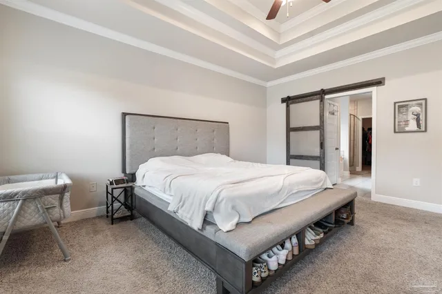 a living room with lots of furniture and a flat screen tv