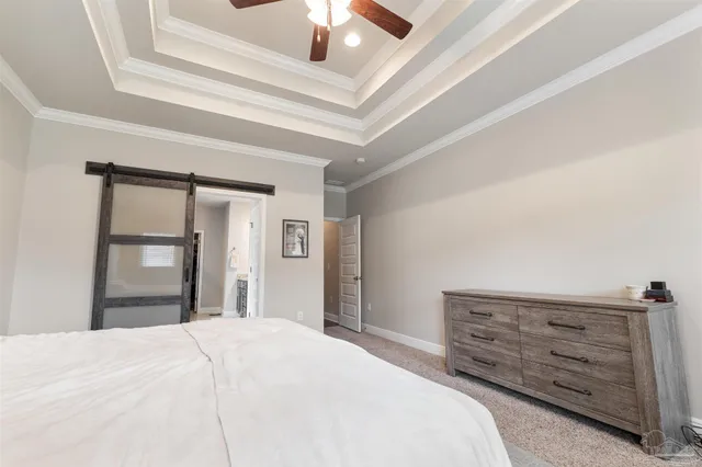 a living room with furniture large window and a flat screen tv