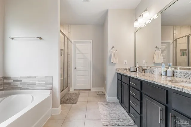 a kitchen with stainless steel appliances granite countertop a lot of counter space and a sink