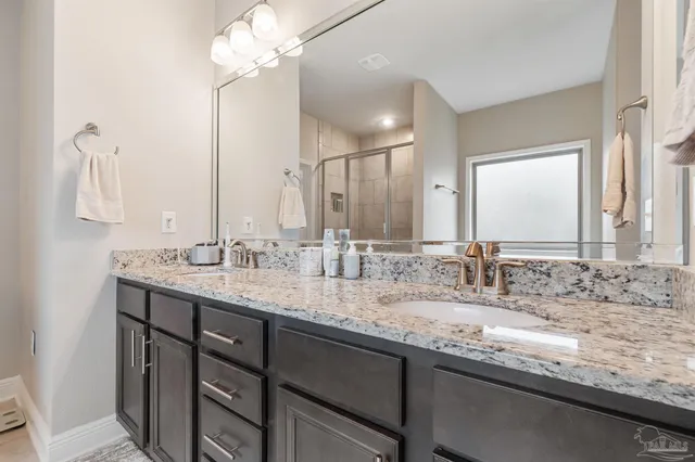 a kitchen with granite countertop stainless steel appliances and wooden cabinets