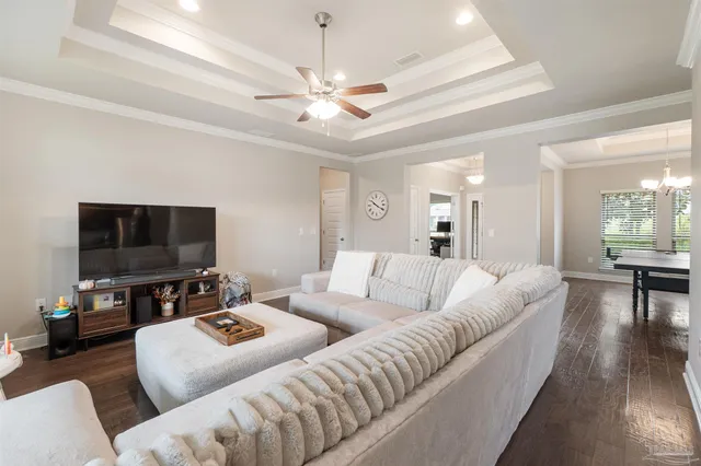 a white toilet sitting next to a bathroom sink and tub