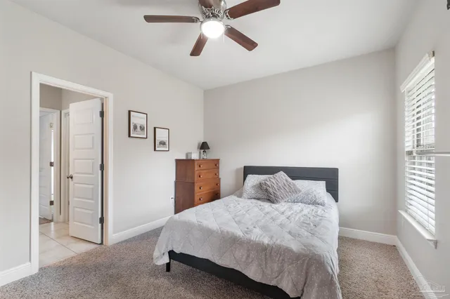 a view of a chairs and table on the roof deck