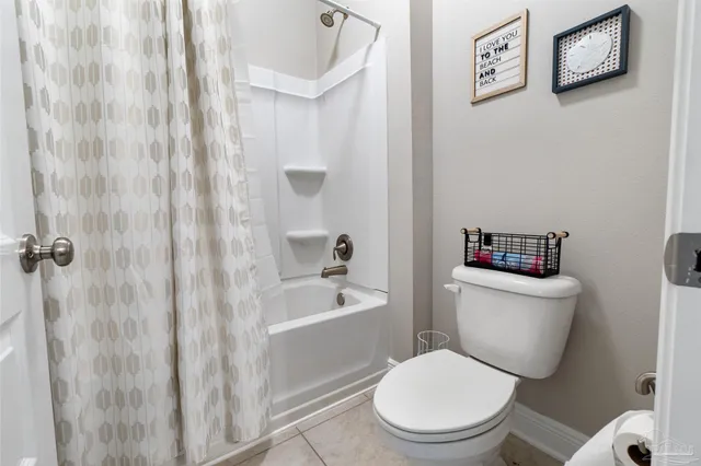 a view of a backyard with wooden fence