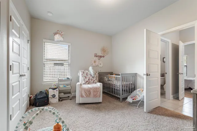 a front view of house with yard and trees