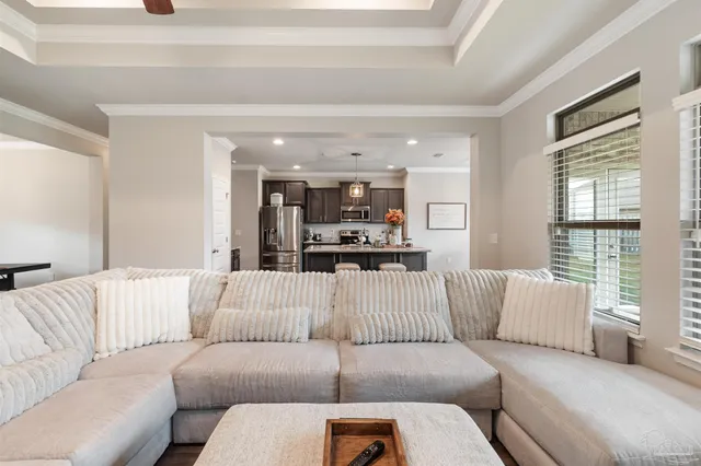 a kitchen with a table chairs stove and refrigerator