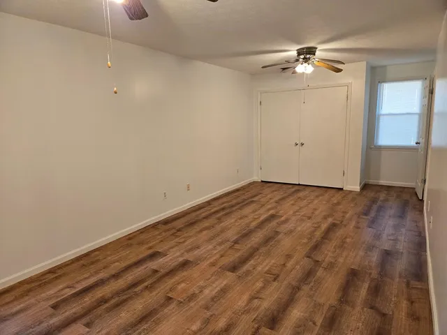 a white toilet sitting next to a bathroom sink