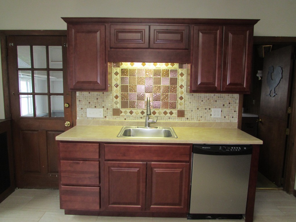 37 Barrison Street Springfield, MA 01109 - Photo 2 of 17 a kitchen with a sink and a window