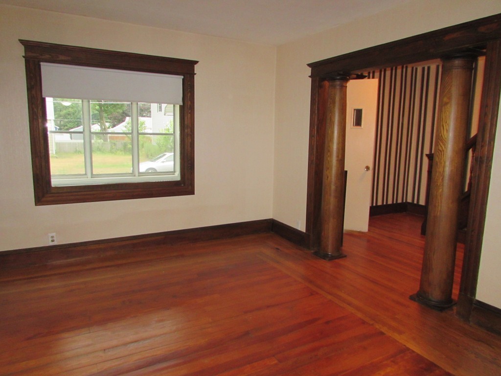 37 Barrison Street Springfield, MA 01109 - Photo 6 of 17 an empty room with wooden floor and a window