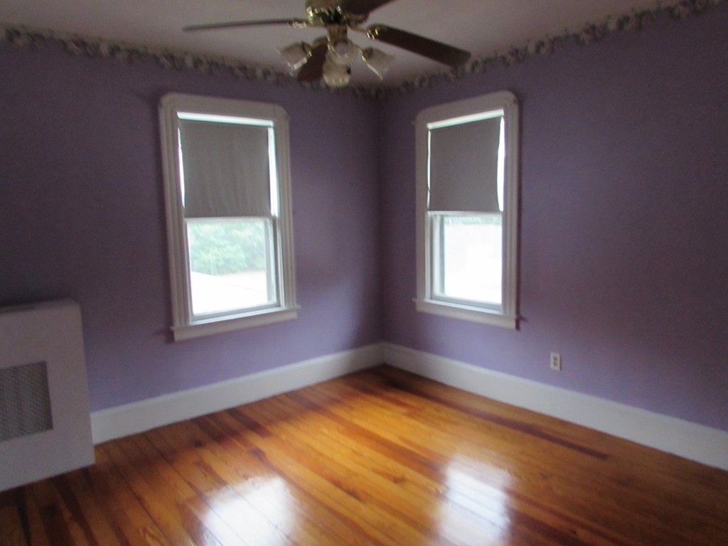 37 Barrison Street Springfield, MA 01109 - Photo 10 of 17 a view of empty room with wooden floor and fan