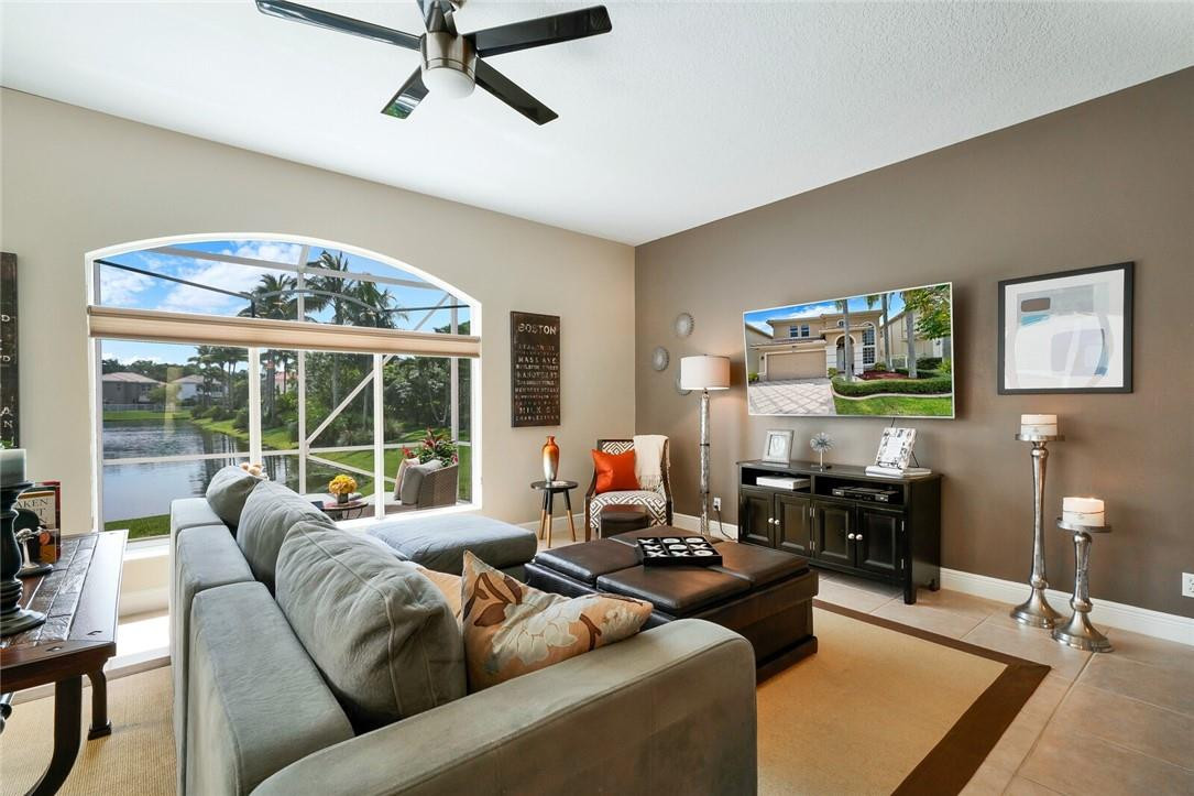 9685 Vineyard Court Boca Raton, FL 33428 - Photo 11 of 45 a living room with furniture and a large window
