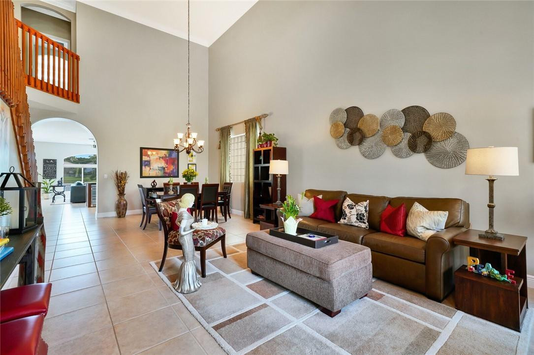 9685 Vineyard Court Boca Raton, FL 33428 - Photo 4 of 45 a living room with furniture and a flat screen tv