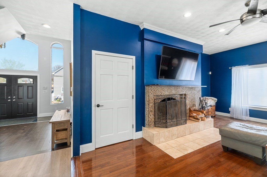 20 Landers Road Stoneham, MA 02180 - Photo 12 of 36 a living room with furniture and a fireplace