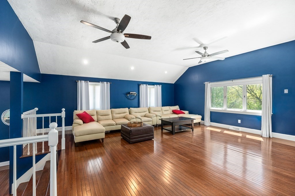 20 Landers Road Stoneham, MA 02180 - Photo 14 of 36 a living room with furniture and a large window
