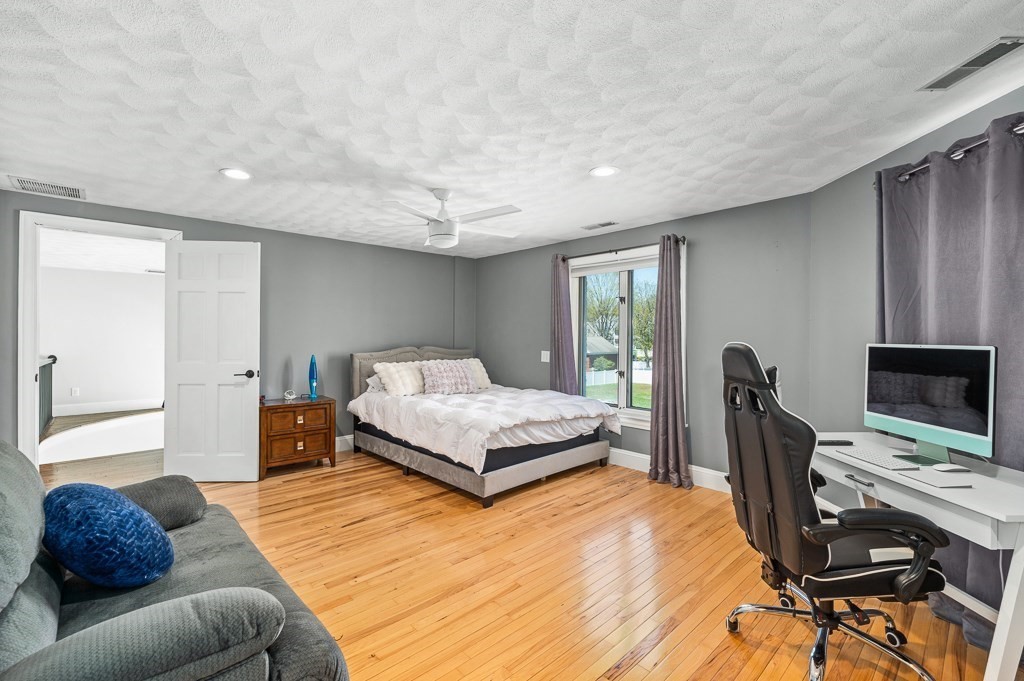20 Landers Road Stoneham, MA 02180 - Photo 21 of 36 a bedroom with a bed window and a chair