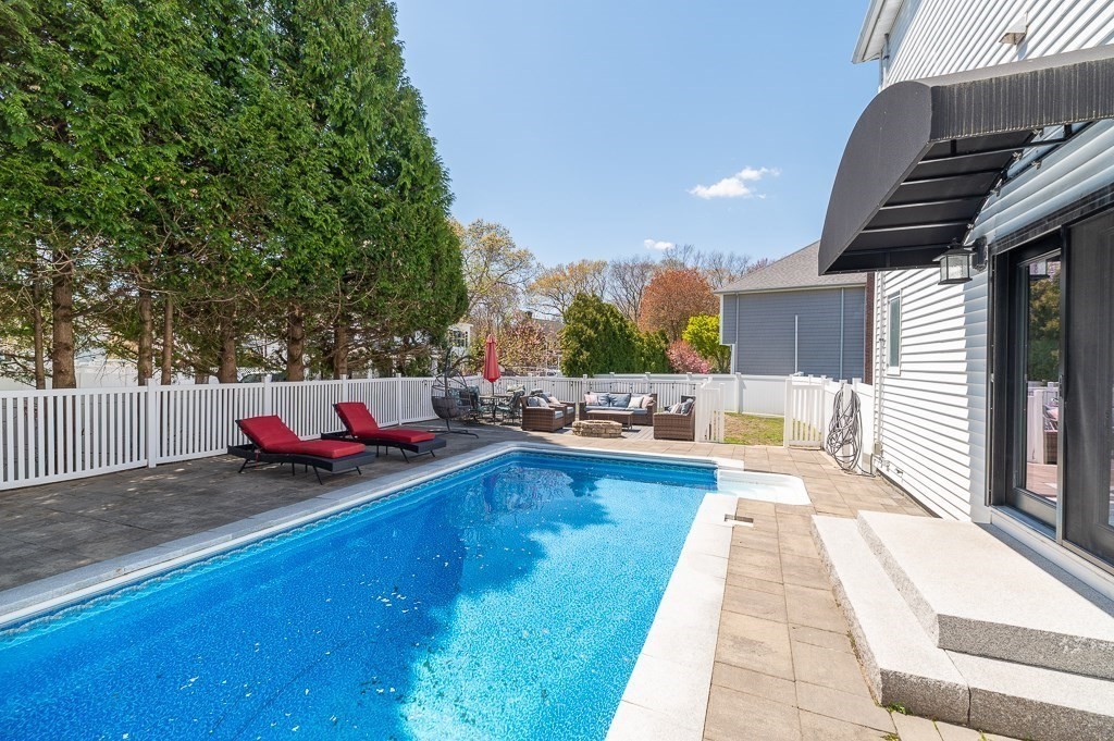 20 Landers Road Stoneham, MA 02180 - Photo 32 of 36 a swimming pool with outdoor seating and yard