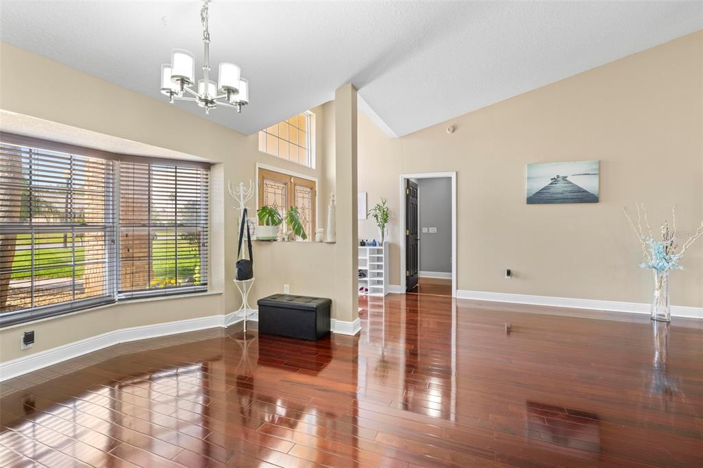 14207 Cornewall Lane Spring Hill, FL 34609 - Photo 18 of 63 a spacious bedroom with furniture and a large window