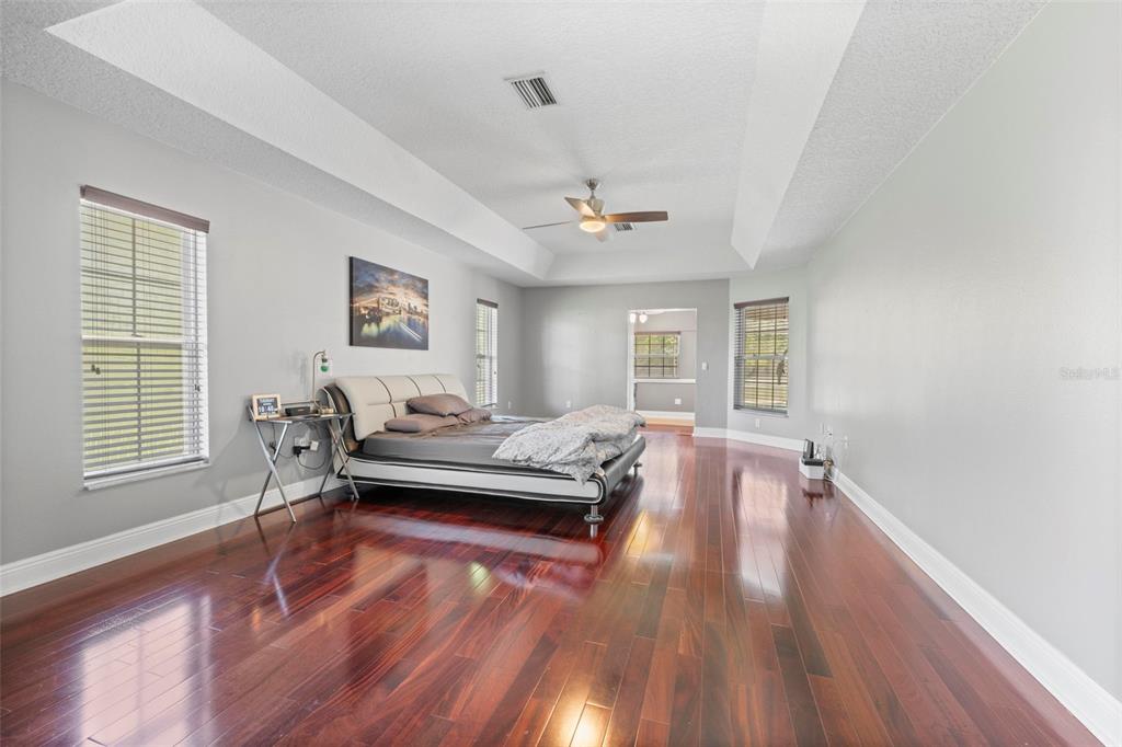 14207 Cornewall Lane Spring Hill, FL 34609 - Photo 29 of 63 a living room with furniture and a wooden floor