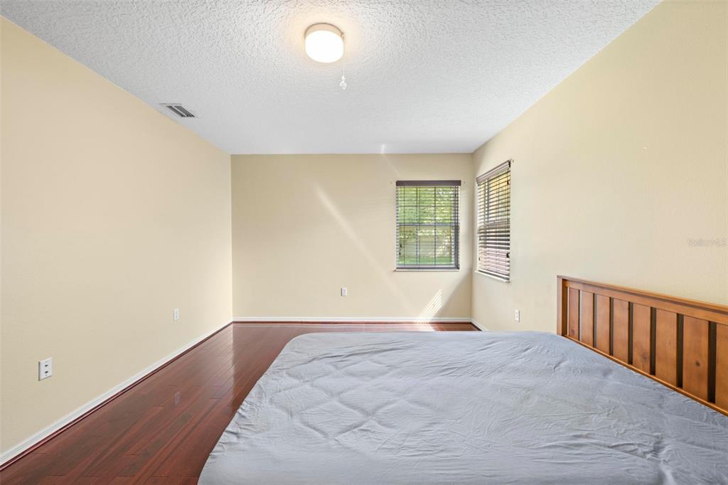 14207 Cornewall Lane Spring Hill, FL 34609 - Photo 38 of 63 a bedroom with a bed and a window