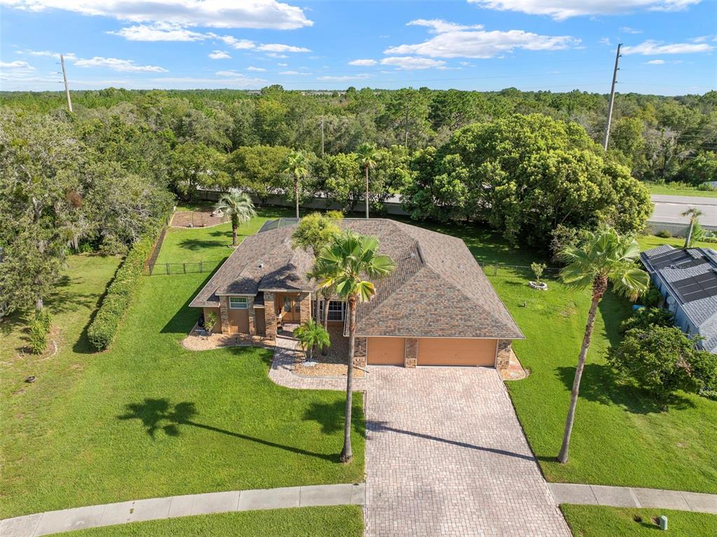 14207 Cornewall Lane Spring Hill, FL 34609 - Photo 46 of 63 an aerial view of a house with a garden