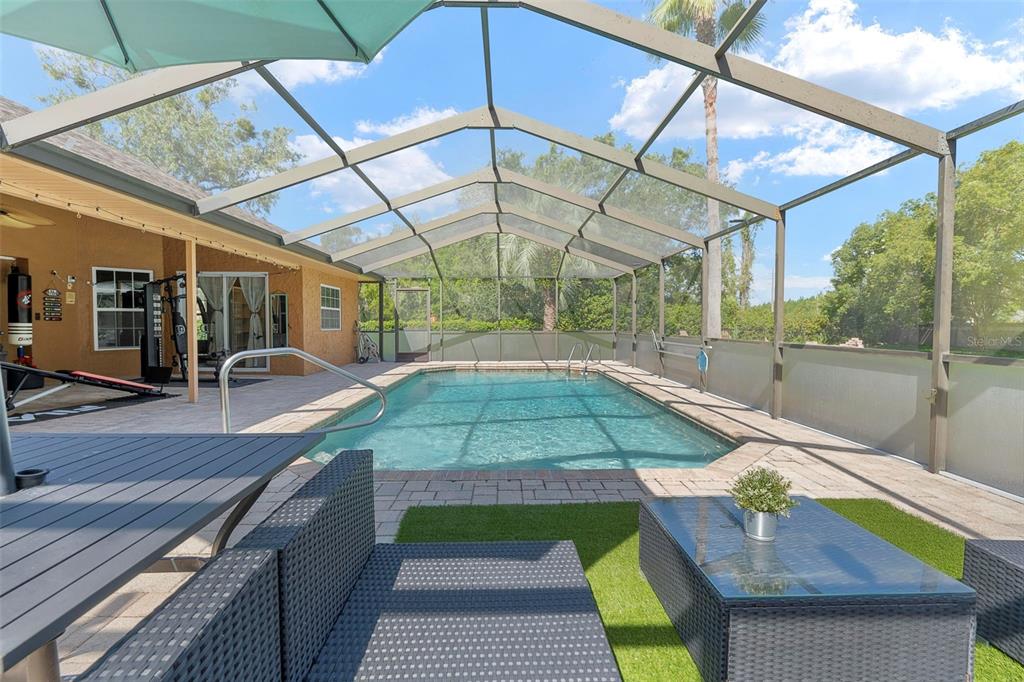 14207 Cornewall Lane Spring Hill, FL 34609 - Photo 58 of 63 a view of a backyard with sitting area