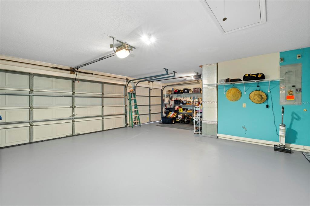 14207 Cornewall Lane Spring Hill, FL 34609 - Photo 61 of 63 a view of a garage with storage