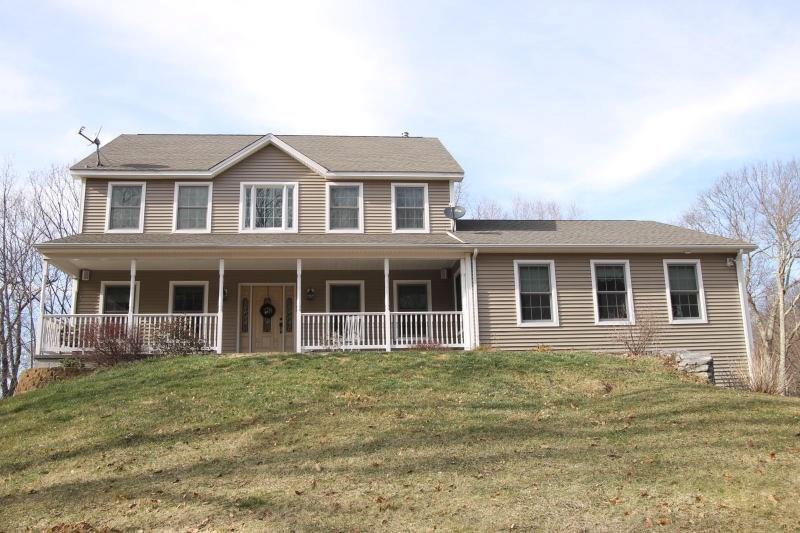 30 Rocky Road West Harwinton, CT 06791 - Photo 1 of 1 a front view of a house with a garden