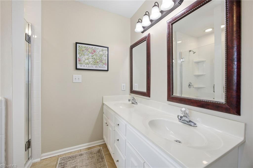 3659 Canopy Oak Court High Point, NC 27265 - Photo 11 of 42 Ensuite primary bathroom with double vanity.