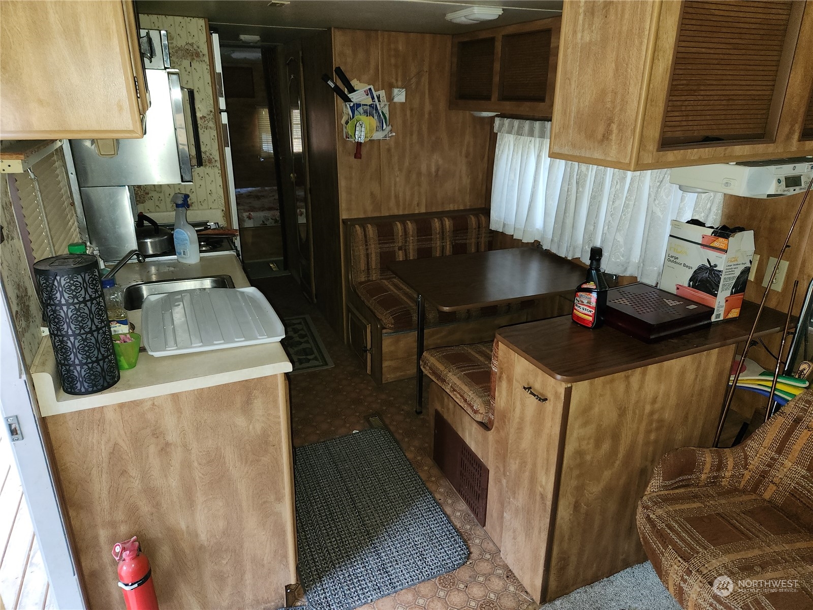 5 Prior Loop Road Oroville, WA 98844 - Photo 14 of 34 a kitchen with a sink stove and refrigerator