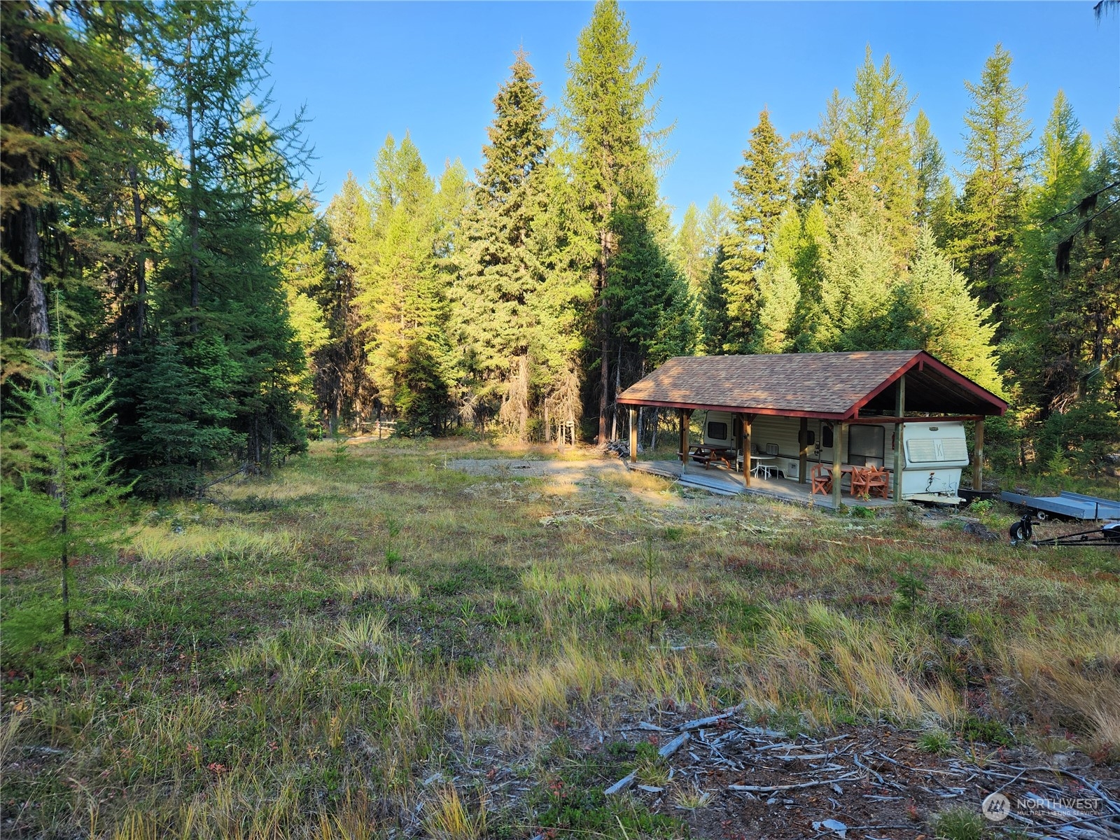 5 Prior Loop Road Oroville, WA 98844 - Photo 3 of 34 a view of a house with a yard