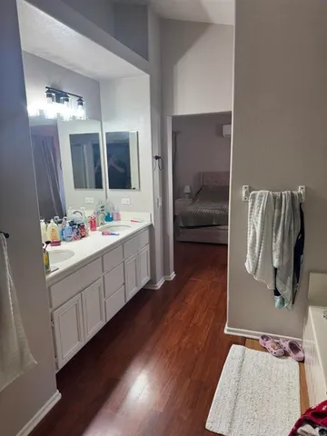 a bathroom with a sink and mirror
