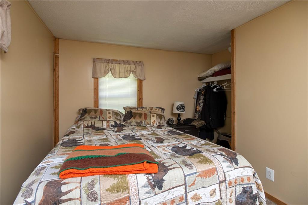 9133 South Watson Run Road Meadville, PA 16335 - Photo 26 of 45 a bed sitting in a bedroom next to a window