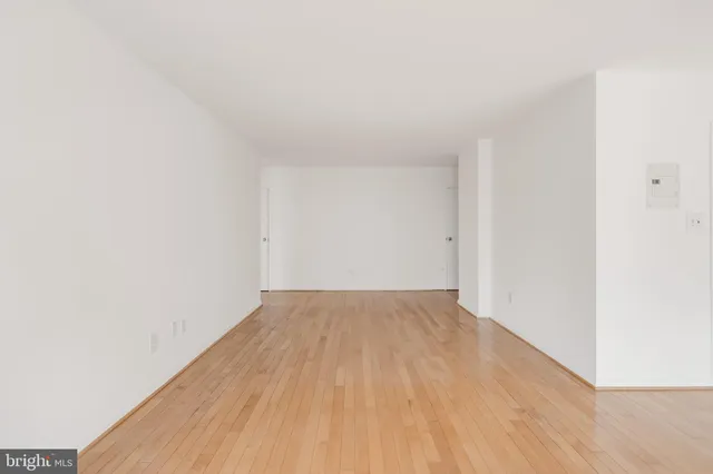 an empty room with wooden floor