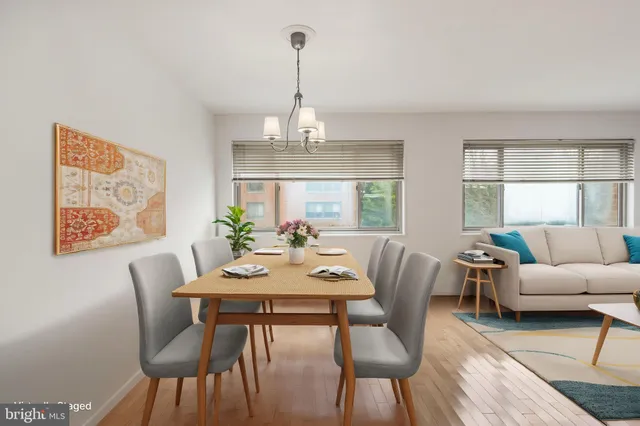 a view of a dining room with furniture window and wooden floor