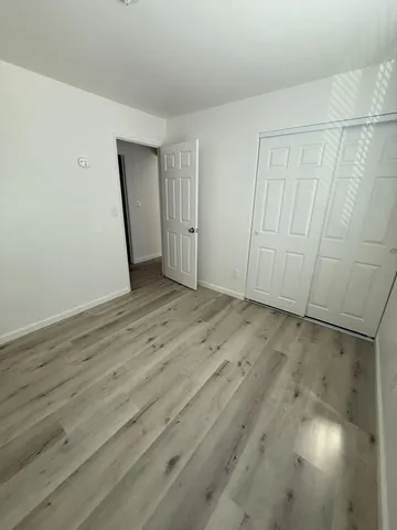 a bathroom with a sink and mirror with toilet