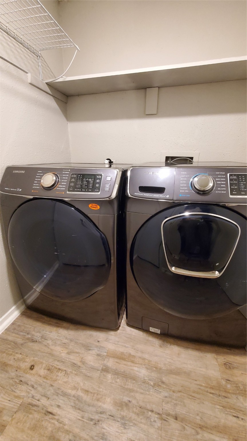 3768 Tanglewilde Street, Unit J5 Houston, TX 77063 - Photo 15 of 24 a utility room with washing machine