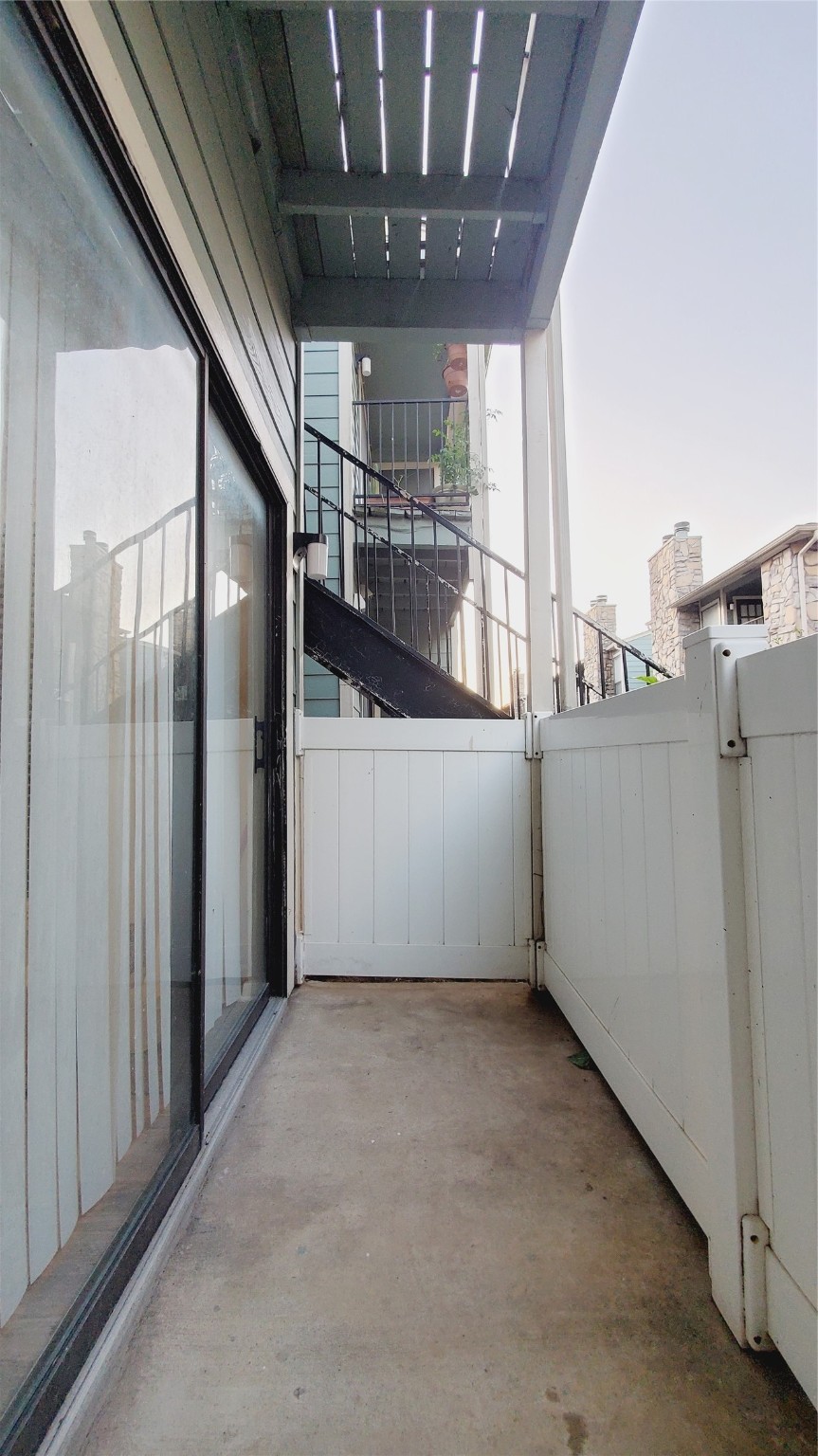 3768 Tanglewilde Street, Unit J5 Houston, TX 77063 - Photo 16 of 24 a view of a hallway with a kitchen