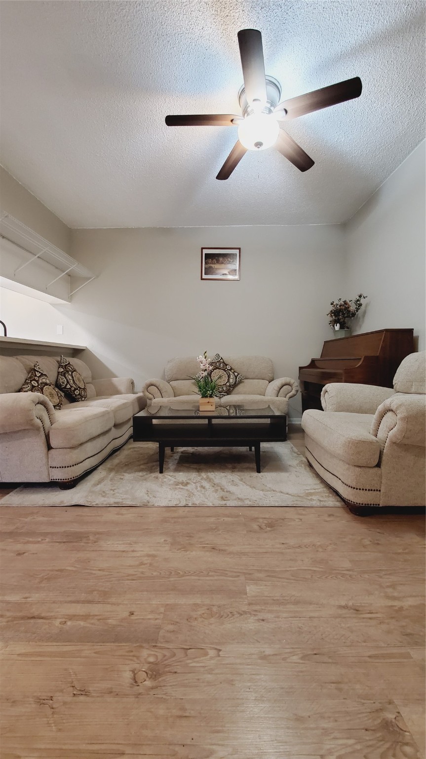 3768 Tanglewilde Street, Unit J5 Houston, TX 77063 - Photo 3 of 24 a living room with furniture
