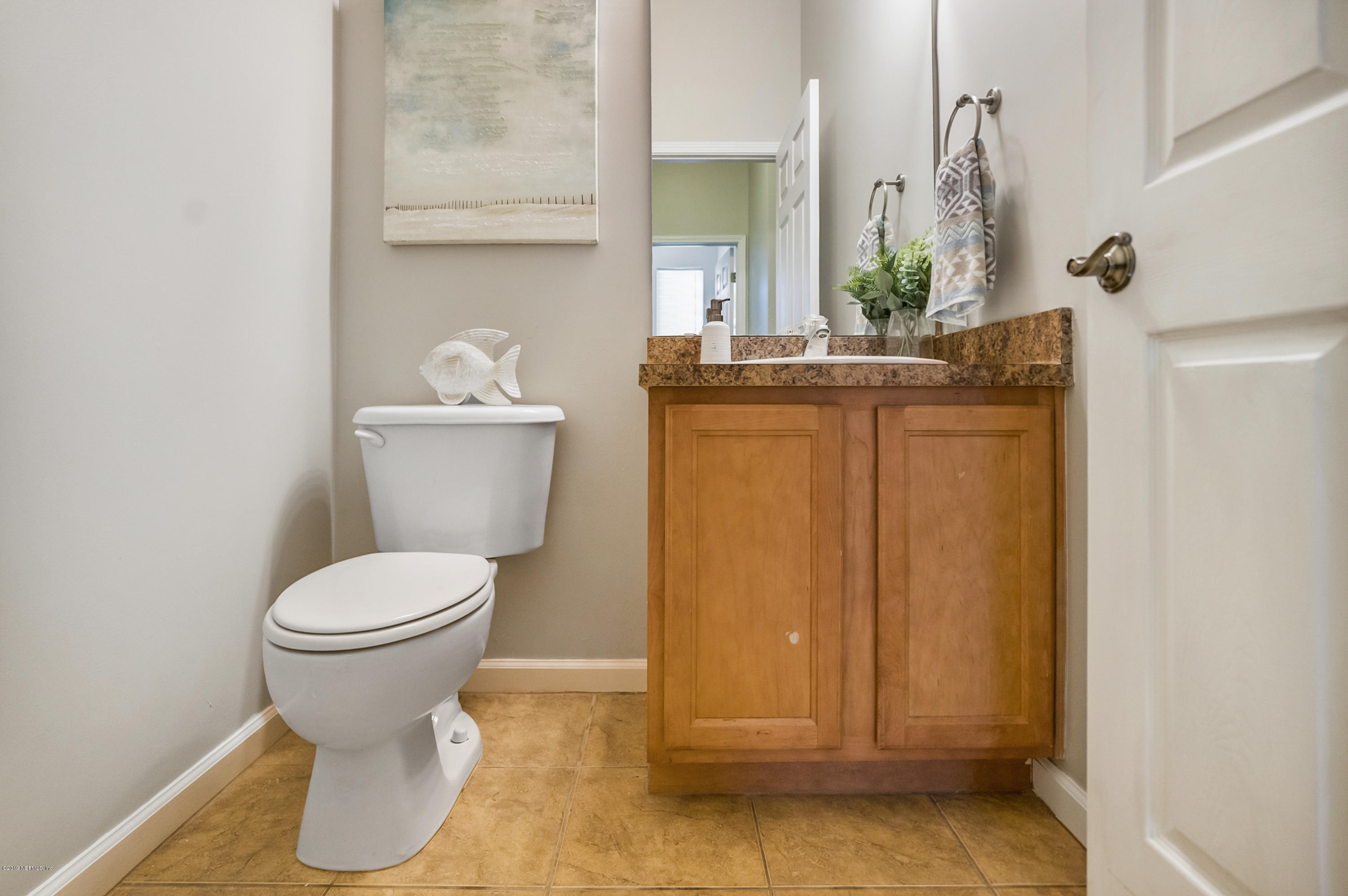 1409 Riva Del Garda Way St. Augustine, FL 32092 - Photo 12 of 41 a bathroom with a toilet and a sink