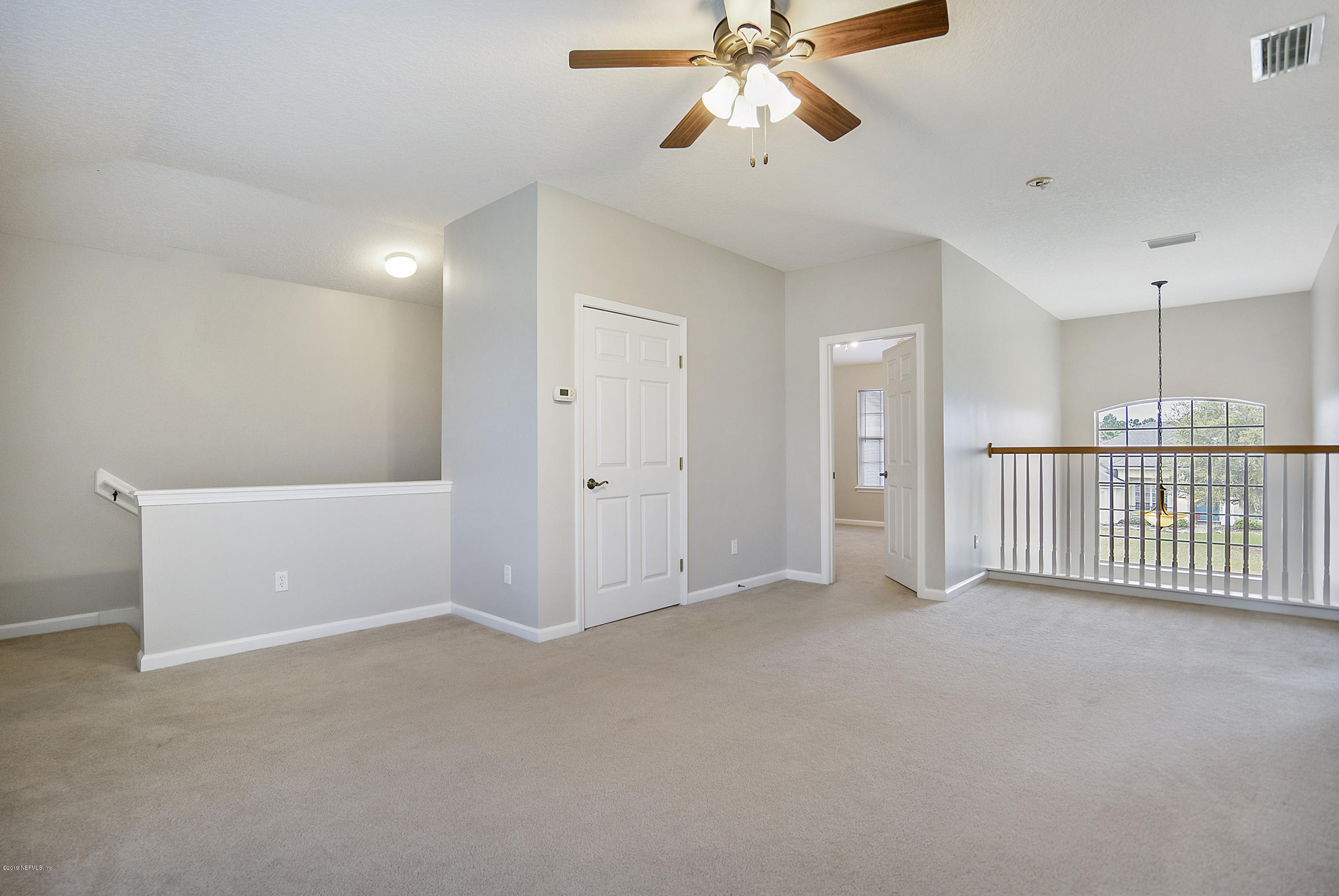 1409 Riva Del Garda Way St. Augustine, FL 32092 - Photo 18 of 41 a view of an empty room with a window