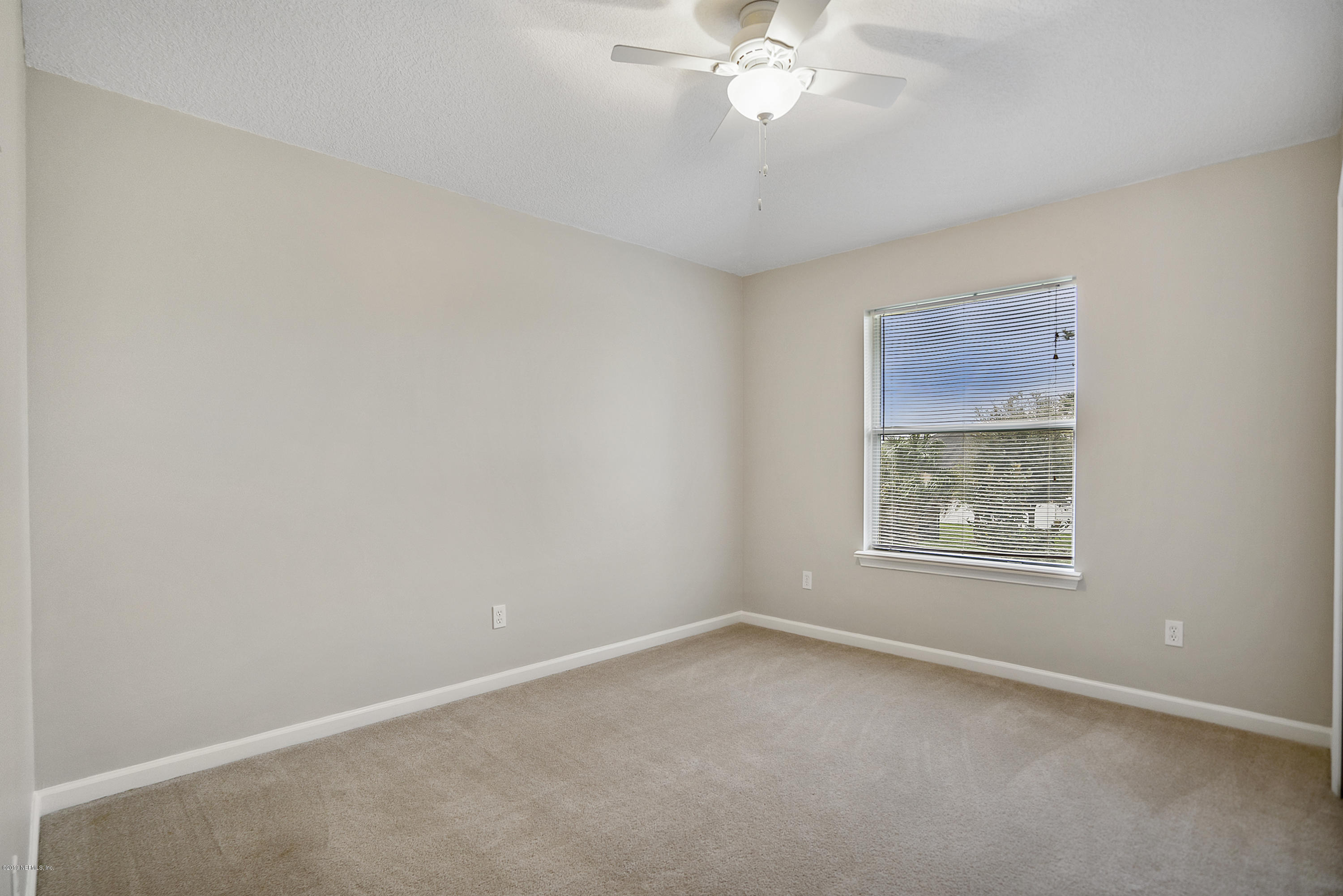 1409 Riva Del Garda Way St. Augustine, FL 32092 - Photo 21 of 41 an empty room with a window