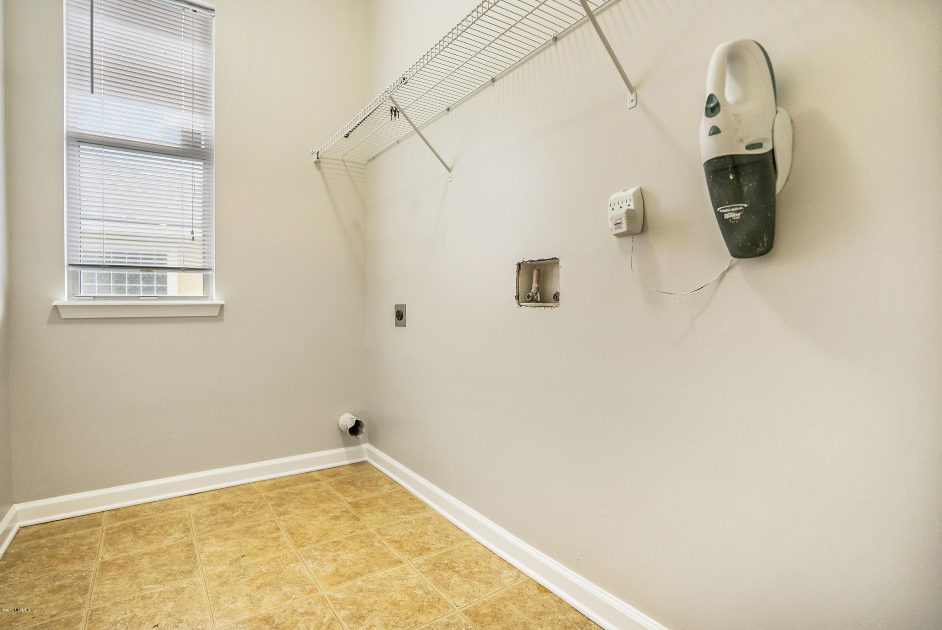 1409 Riva Del Garda Way St. Augustine, FL 32092 - Photo 24 of 41 a bathroom with a tub