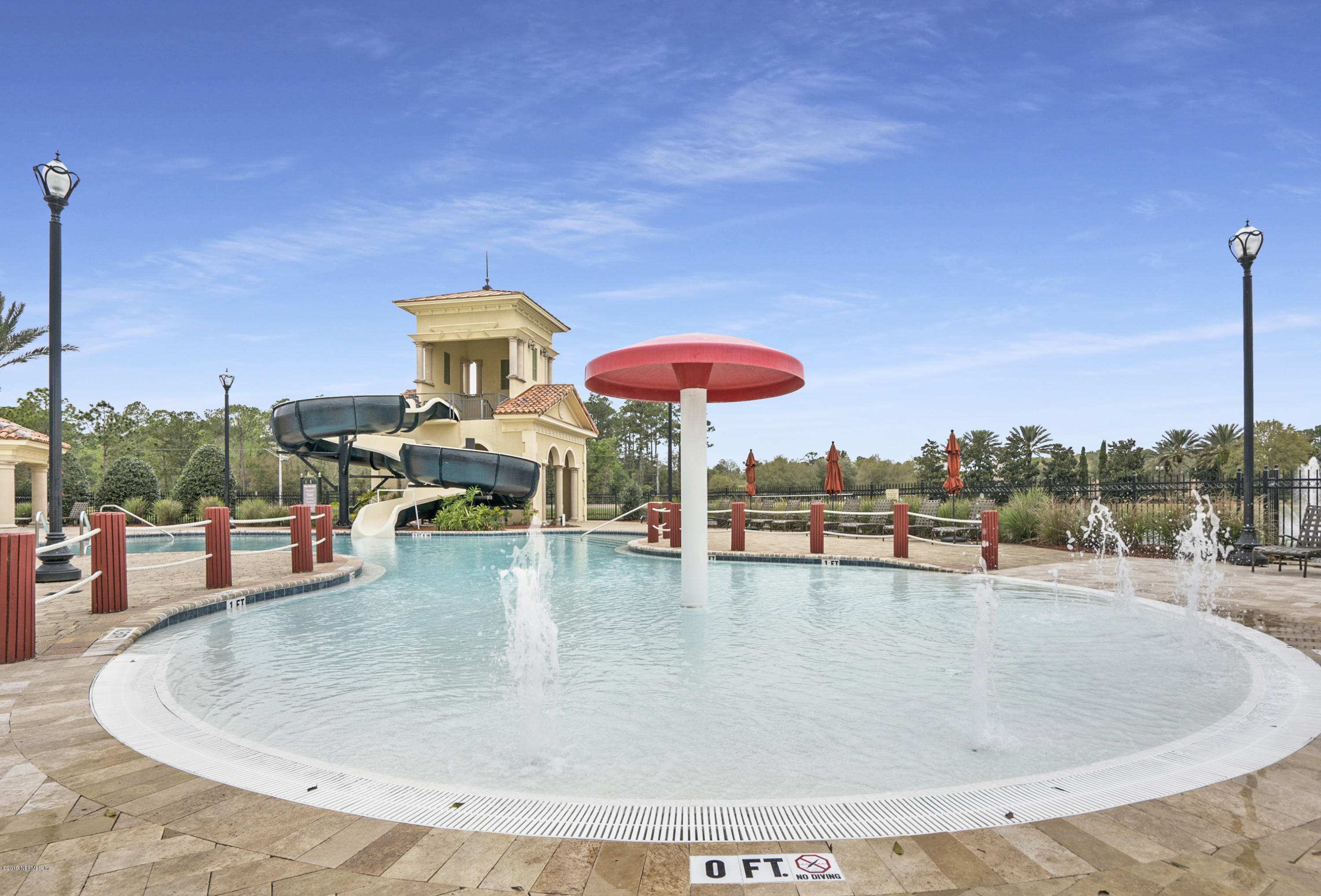 1409 Riva Del Garda Way St. Augustine, FL 32092 - Photo 32 of 41 a view of a swimming pool with a table and chairs