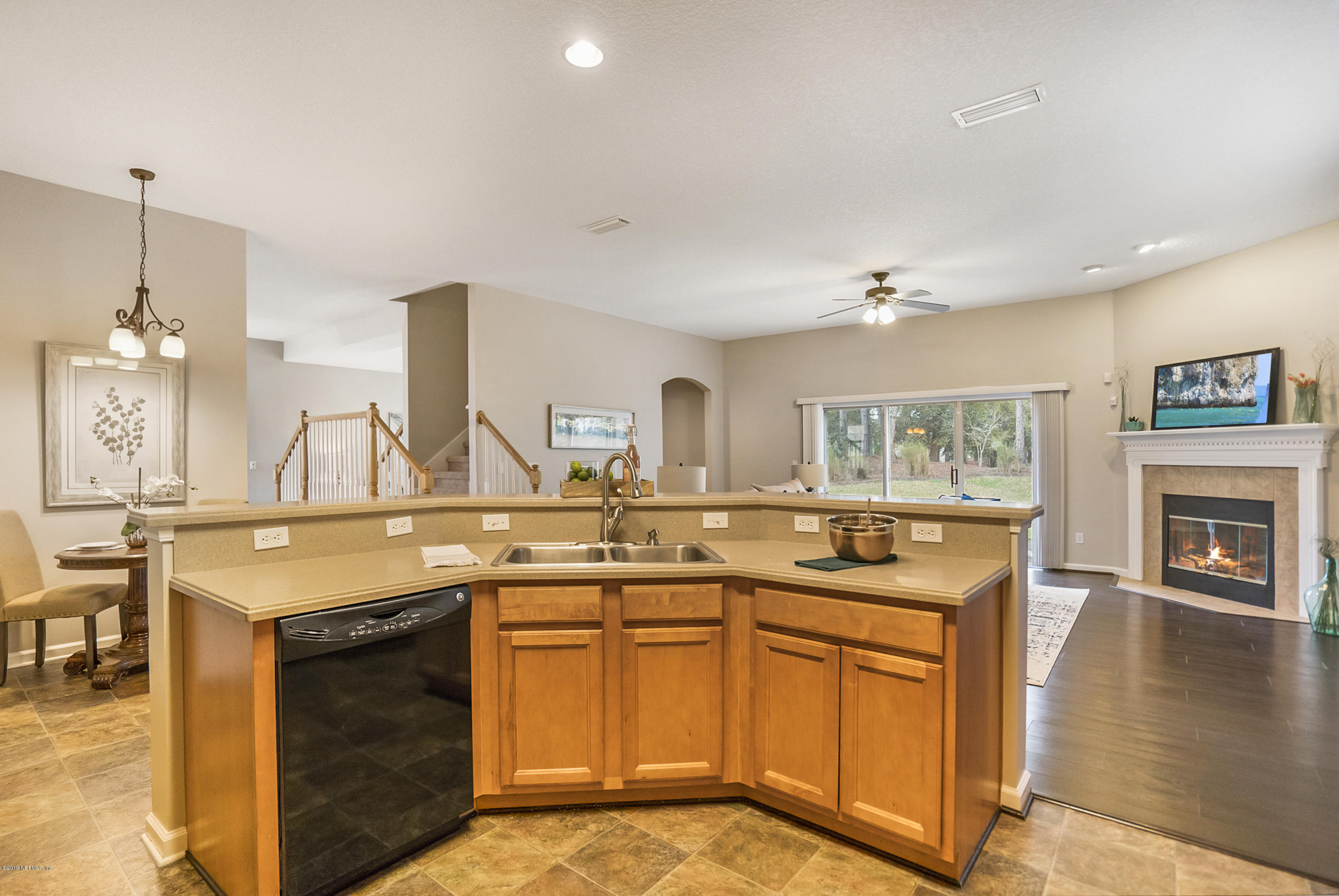 1409 Riva Del Garda Way St. Augustine, FL 32092 - Photo 6 of 41 a kitchen with stainless steel appliances granite countertop a stove a sink and a refrigerator