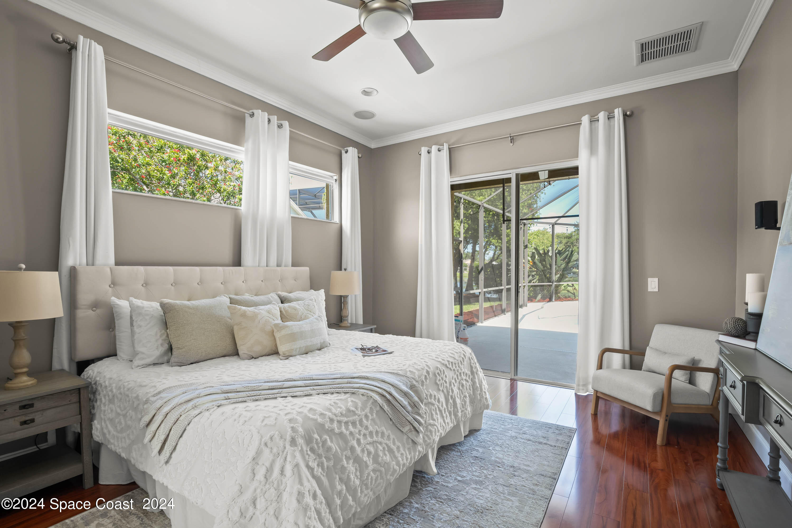 1122 Jan's Place Melbourne, FL 32940 - Photo 15 of 42 a bedroom with a large bed and a window